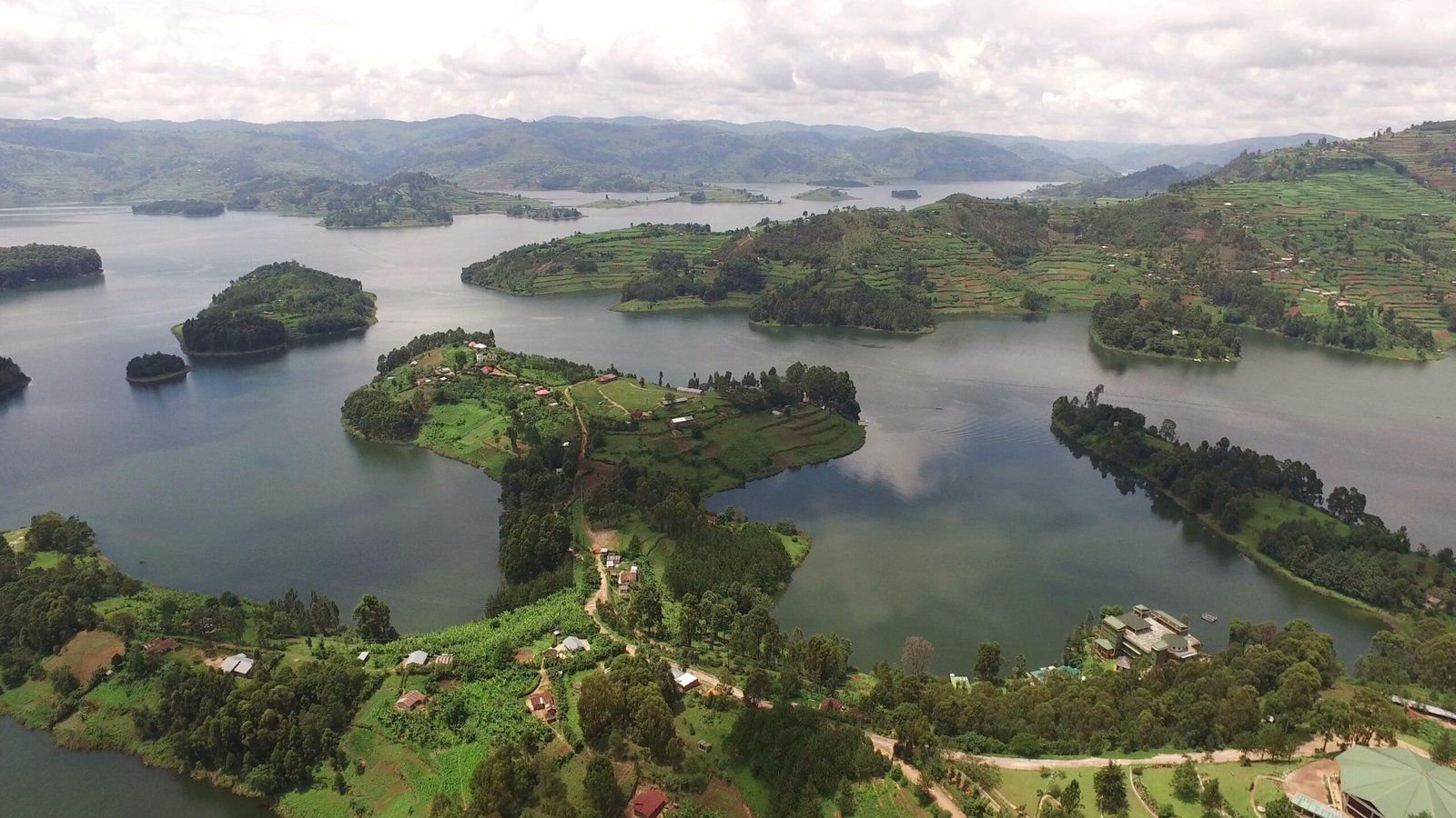 Beautiful view of Lake Bunyonyi surrounded by green terraced hills and peaceful islands in southwestern Uganda. Uganda Safari